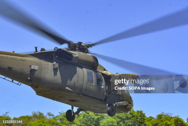 View of a Black Hawk UH-60L helicopter as it flies off. The United States Southern Command Joint Task Force-Bravo performed conjoined operations in...