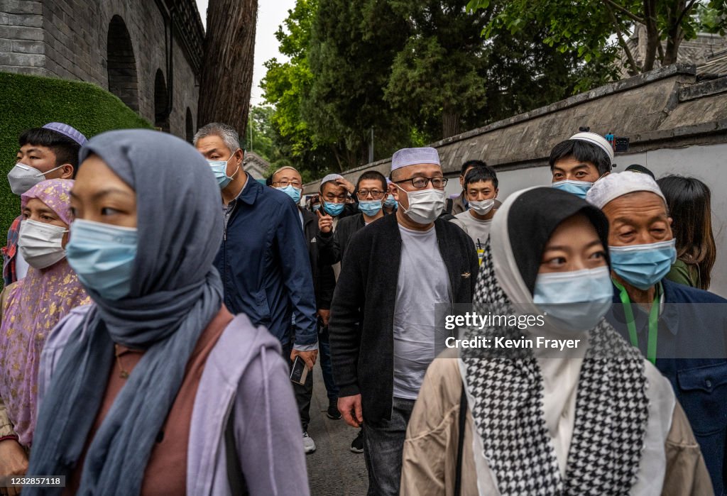 Chinese Musims Hui Muslims wear masks as they arrive for Eid al-Fitr prayers at the ...