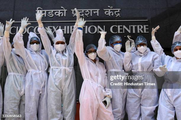 Nurses in PPE kits pose for a photo as they celebrate International Nurses Day at CIDCO Exhibition COVID Centre, Vashi, on May 12, 2021 in Navi...