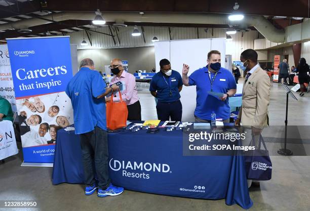 People seeking employment speak to recruiters at the 25th annual Central Florida Employment Council Job Fair at the Central Florida Fairgrounds. More...