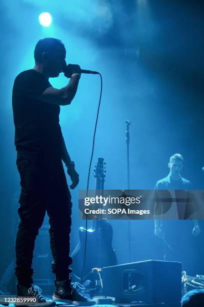 Konstantin Semin and the group's saxophonist in blue light. Concert of the rock group Gianni Rodari, journalist, documentary filmmaker and public...