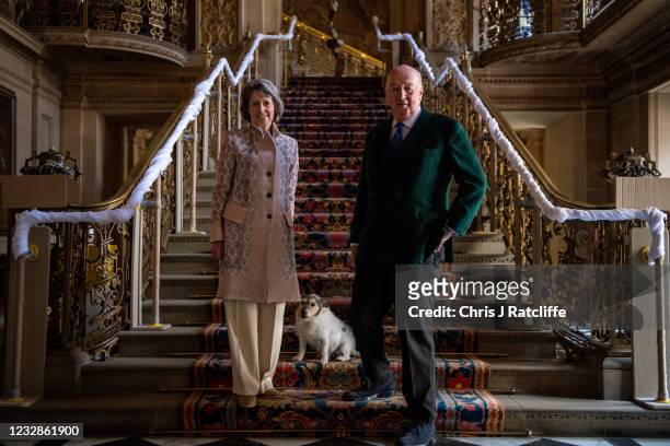 The Duke and Duchess of Devonshire, with their dog Max, pose for photographs at their home, Chatsworth House on May 13, 2021 in Bakewell, England....