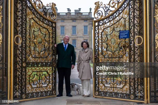 The Duke and Duchess of Devonshire, with their dog Max, pose for photographs at the gates to their home, Chatsworth House on May 13, 2021 in...