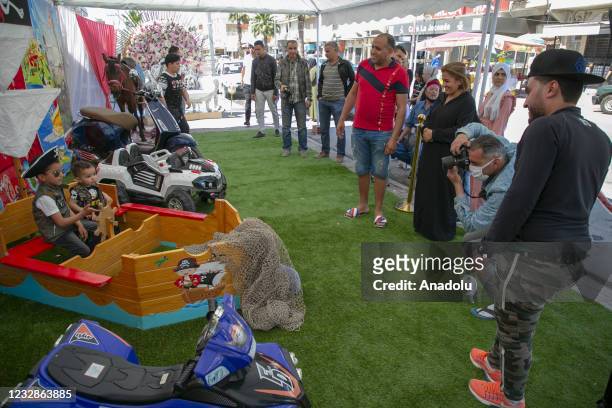 Tunisian families take their children out to playgrounds as a celebration to mark the Eid al-Fitr amid the coronavirus pandemic in Tunis, Tunisia on...