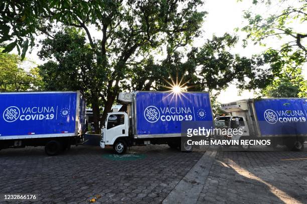 Trucks carrying covid-19 vaccines leave the National Biological Center of the Ministry of Health for Honduras, in Soyapango, El Salvador, on May 13,...