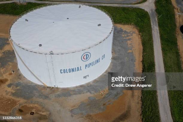 In an aerial view, fuel holding tanks are seen at Colonial Pipeline's Dorsey Junction Station on May 13, 2021 in Woodbine, Maryland. The Colonial...