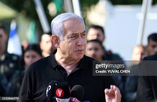 Israeli Prime Minister Benjamin Netanyahu speaks during a meeting with Israeli border police in the central city of Lod, near Tel Aviv, on May 13 a...