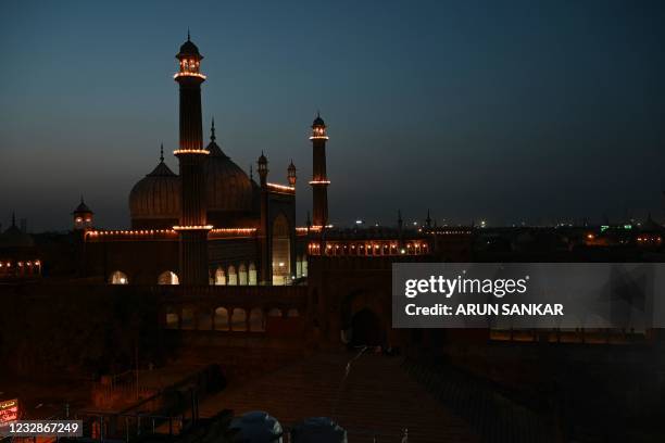 The Jama Masjid is seen illuminated at night during Eid-al-Fitr, which marks the end of the holy month of Ramadan, in New Delhi on May 13, 2021.