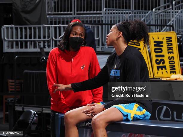 Candace Parker of the Chicago Sky talks with Tamika Catching of the Indiana Fever at Bankers Life Fieldhouse on May 3, 2021 in Indianapolis, Indiana....