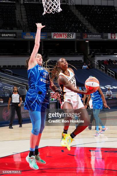 Tiffany Mitchell of the Indiana Fever drives to the basket against Stefanie Dolson the Chicago Sky at Bankers Life Fieldhouse on May 3, 2021 in...