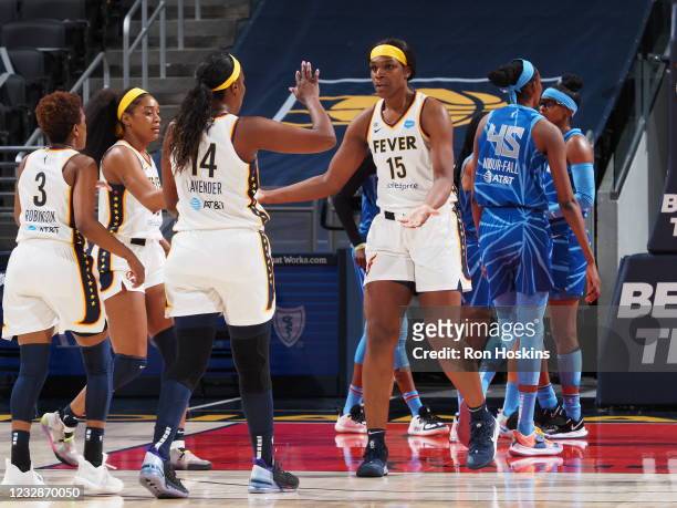 Teaira McCowan of the Indiana Fever high fives a teammate during the game against the Chicago Sky at Bankers Life Fieldhouse on May 3, 2021 in...