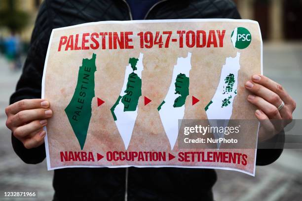 People demonstrate solidarity with Palestine at the Main Square in Krakow, Poland on May 13, 2021. Protestors were demanding an end to Israeli...