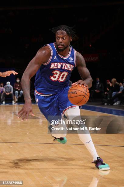 Julius Randle of the New York Knicks dribbles the ball during the game against the San Antonio Spurs on May 13, 2021 at Madison Square Garden in New...