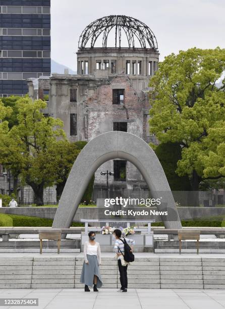 People wearing masks visit Peace Memorial Park in Hiroshima, western Japan, on May 14, 2021. The Japanese government is set to add Hiroshima...
