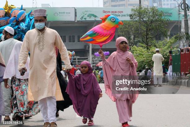 Bangladeshi Muslims gather to celebrate Eid Al-Fitr festival during a lockdown following the COVID-19 coronavirus pandemic in Dhaka, Bangladesh on...