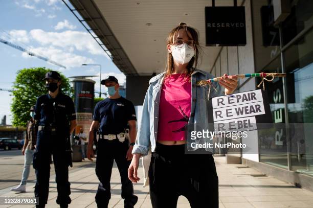 Climate activists gathered in front of one of Warsaw city center's shopping malls in a protest against ''fast fashion'' - rapidly changing trends,...