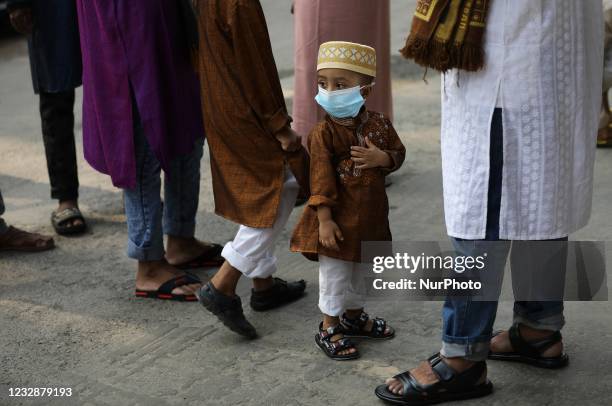 Devotees offer Eid-al-Fitr prayers at a mosque in Gulshan area during Muslim's Eid-al-Fitr festival marking the end of the holy fasting month of...