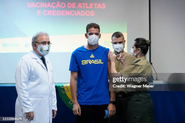 Brazilian athlete Marcus Vinicius D Almeida from archery receives a first dose of Pfizer vaccine as part of the anti COVID-19 vaccination of...