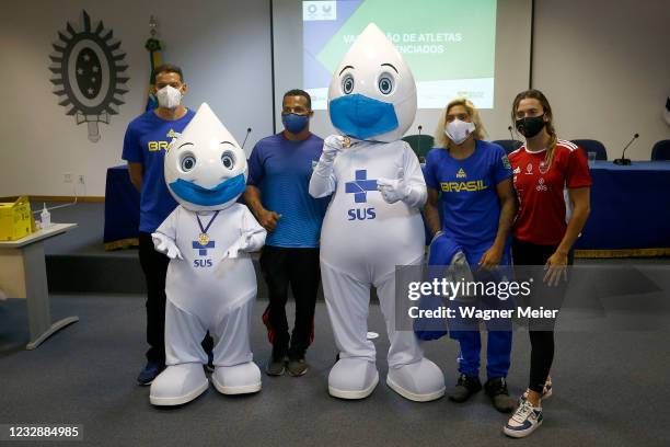 Brazilian athletes Marcus Vinícius D Almeida, Michel Pessanha, Ana Marcela Cunha and Larissa de Oliveira pose for a photo after receiving the first...