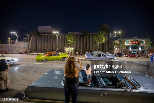 Van Nuys, CA Karla Ramirez sits in her familys 1963 Chevrolet Impala Super Sport while watching cruisers ride by during the Van Nuys Cruise Night on...