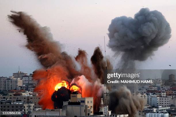 Smoke billows after an Israeli airstrike on Gaza City targeted the Ansar compound, linked to the Hamas movement, in the Gaza Strip on May 14, 2021. -...