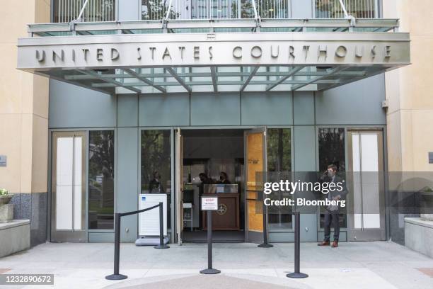 Attorney Justin Clarke talks on the phone during a lunch break at U.S. District court in Oakland, California, U.S., on Friday, May 2021. Epic Games...