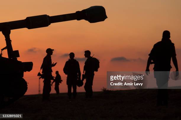Israeli soldiers prepare thier artillery unit near the border with Gaza Strip on May 14, 2021 in Sderot, Israel. This follows days of violence and...