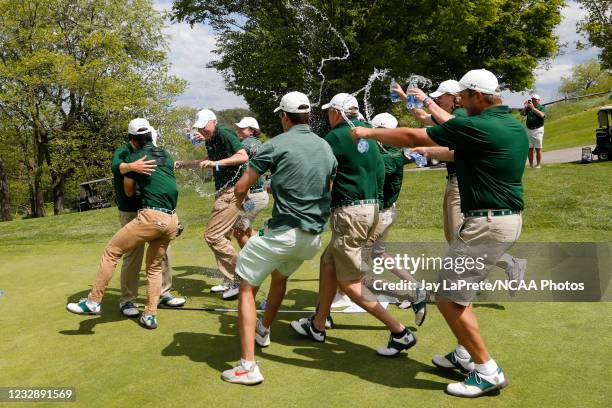 Illinois Wesleyan Titans players celebrate on the 18th green after winning the Division III Mens Golf Championship held at the Oglebay Resort on May...