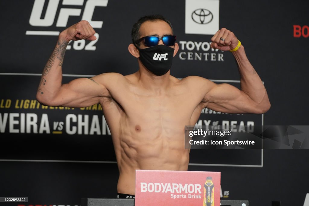Tony Ferguson jumps on the scale for the UFC 262 Official Weigh-in