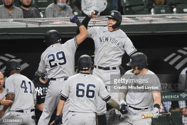 Gio Urshela of the New York Yankees celebrates a pinch hit three run home run in the seventh inning with Aaron Judge during a baseball game against...