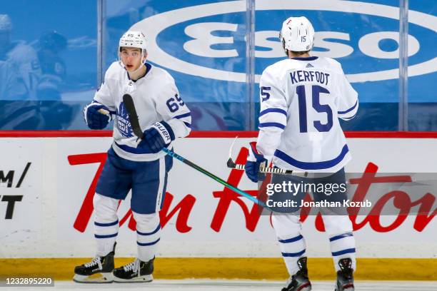 Ilya Mikheyev and Alexander Kerfoot of the Toronto Maple Leafs celebrate a second period goal against the Winnipeg Jets at the Bell MTS Place on May...