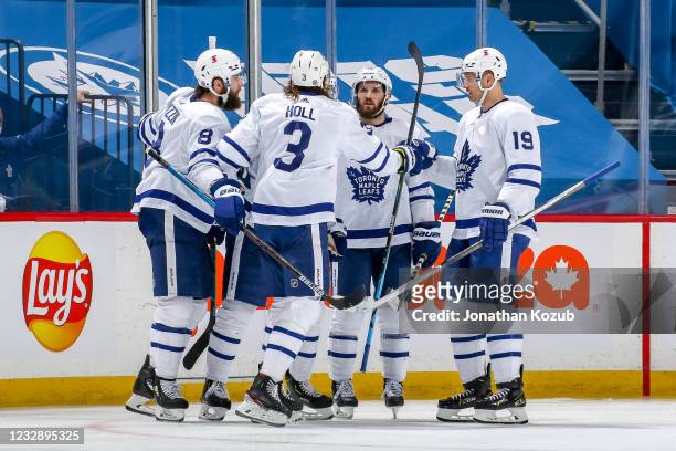 Jake Muzzin, Justin Holl, Ilya Mikheyev, Alexander Kerfoot and Jason Spezza of the Toronto Maple Leafs celebrate a second period goal against the...