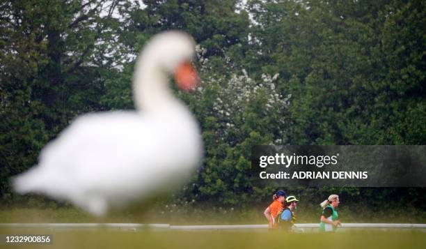 Swan is seen in the foreground as competitors take part in the non socially-distanced Reunion 5K running race, one of the pilot events in the...