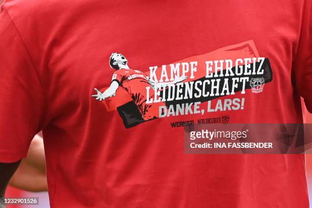 Player of Leverkusen wears a T-shirt reading "Fight, ambition, passion. Thank you Lars!" prior to the German first division Bundesliga football match...