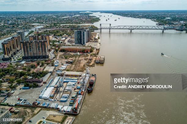 An aerial view taken on May 5, 2021 shows a railway bridge over the Volga river and a port in the city of Astrakhan.