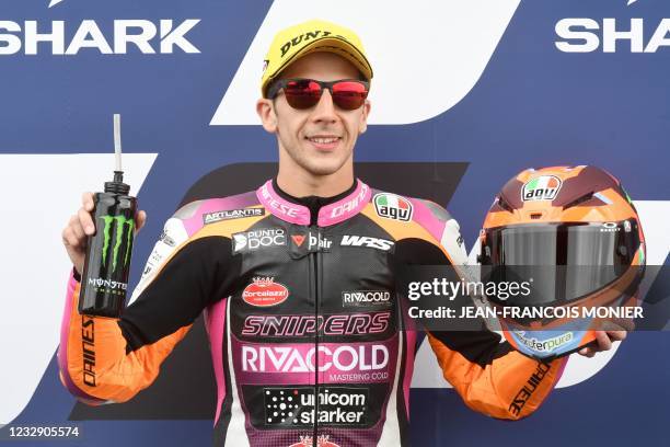 Honda Rivacold Sniper Team Italian rider Andrea Migno reacts after taking the pole position of the Q2 qualifying session in the Moto3 in 1'49.408,...