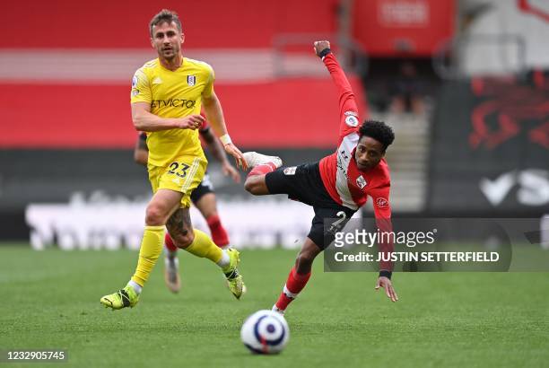 Fulham's English defender Joe Bryan vies with Southampton's English defender Kyle Walker-Peters during the English Premier League football match...