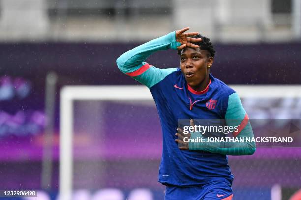 Barcelona's Nigerian forward Asisat Oshoala reacts during a training session on the eve of the UEFA Women's Champions League final between Chelsea FC...