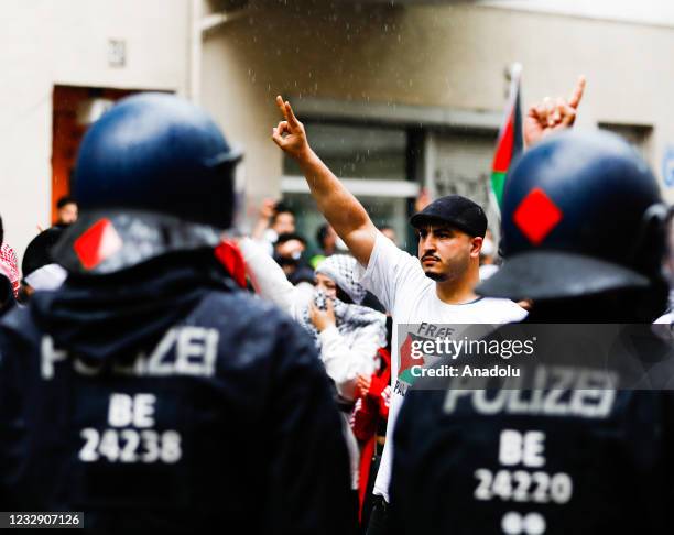 People gather to stage a demonstration in support of Palestinians and to protest against Israeli attacks on Gaza Strip, on May 15, 2021 in Berlin,...