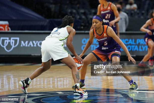 Shey Peddy of the Phoenix Mercury defends against the Minnesota Lynx on May 14, 2021 at Target Center in Minneapolis, Minnesota. NOTE TO USER: User...