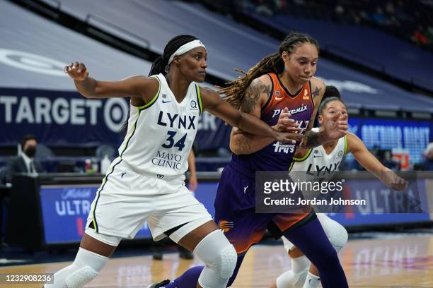 Sylvia Fowles of the Minnesota Lynx fights for position against Brittney Griner of the Phoenix Mercury on May 14, 2021 at Target Center in...