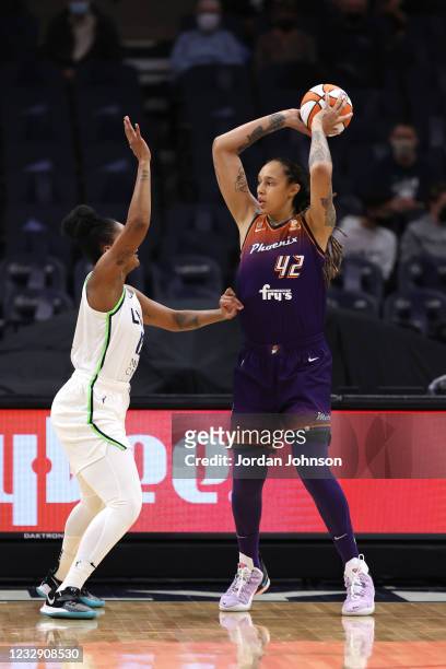 Brittney Griner of the Phoenix Mercury moves the ball against the Minnesota Lynx on May 14, 2021 at Target Center in Minneapolis, Minnesota. NOTE TO...