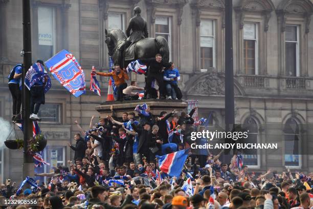 Rangers fans celebrate in George Square in Glasgow on May 15 after Rangers lift the Scottish Premiership trophy for the first time in 10 years. -...