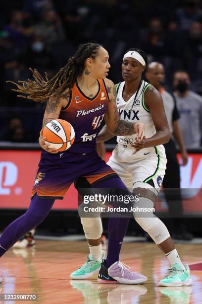Brittney Griner of the Phoenix Mercury moves the ball against the Minnesota Lynx on May 14, 2021 at Target Center in Minneapolis, Minnesota. NOTE TO...