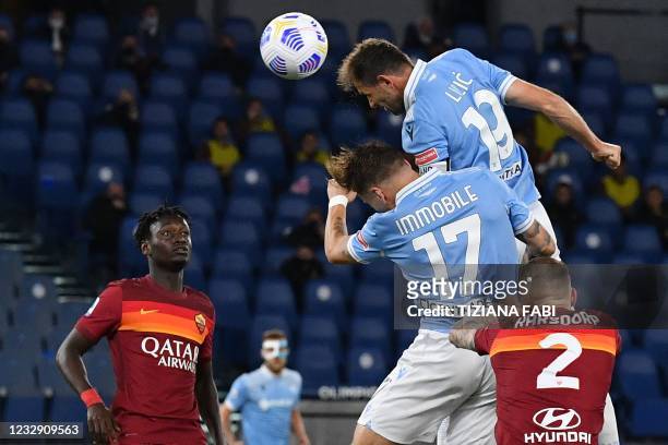 Lazio's Bosnian midfielder Senad Lulic goes for a header during the Italian Serie A football match AS Rome vs Lazio Rome on May 15, 2021 at the...