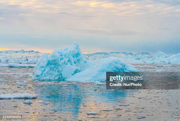 Icebergs near Ilulissat, Greenland. Climate change is having a profound effect in Greenland with glaciers and the Greenland ice cap retreating.