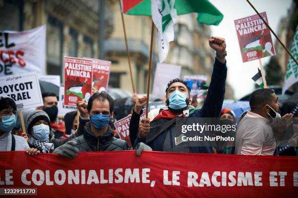 Protester raises his fist during the protest. Hundreds of people gathered in support of Gaza and the Occupied Territories as a new war seems to have...