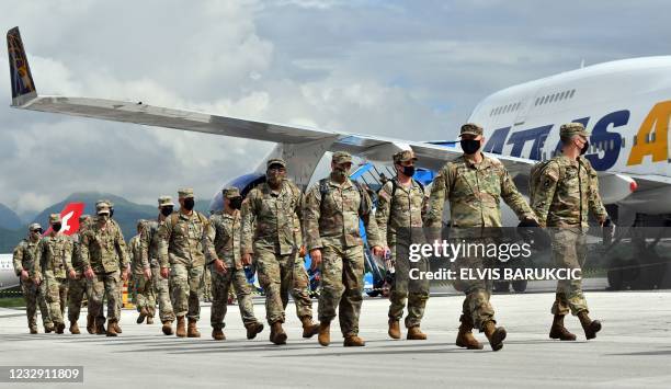 Soldiers disembark the Boeing 747-400 "Atlas Air" upon their arrival at Sarajevo International Airport on May 15, 2021. - American soldiers arrived...