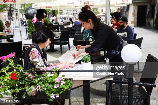 Restaurant gardens at the Main Square are reopened after the lockdown due to the coronavirus pandemic in Krakow, Poland on May 15, 2021. From today...