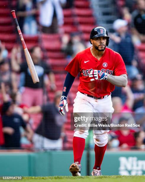 Xander Bogaerts of the Boston Red Sox flips his bat after hitting a three run home run during the fifth inning of a game against the Los Angeles...